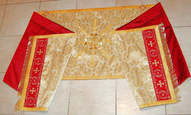 Solemn High Mass Vestments in real metal fabric, extensively trimmed, lined in pure silk.